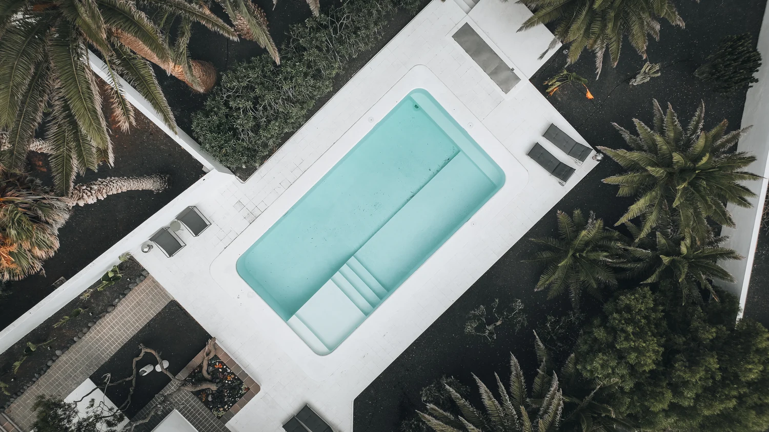 The private pool and white terrace seen from above.