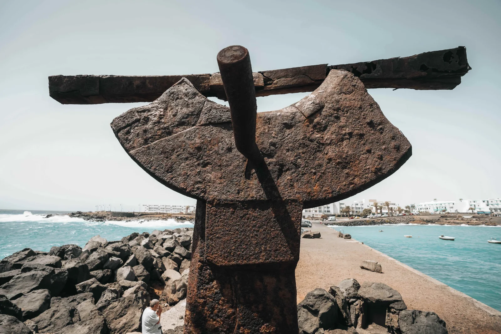 A coastal sculpture and sheltered bay in Costa Teguise.