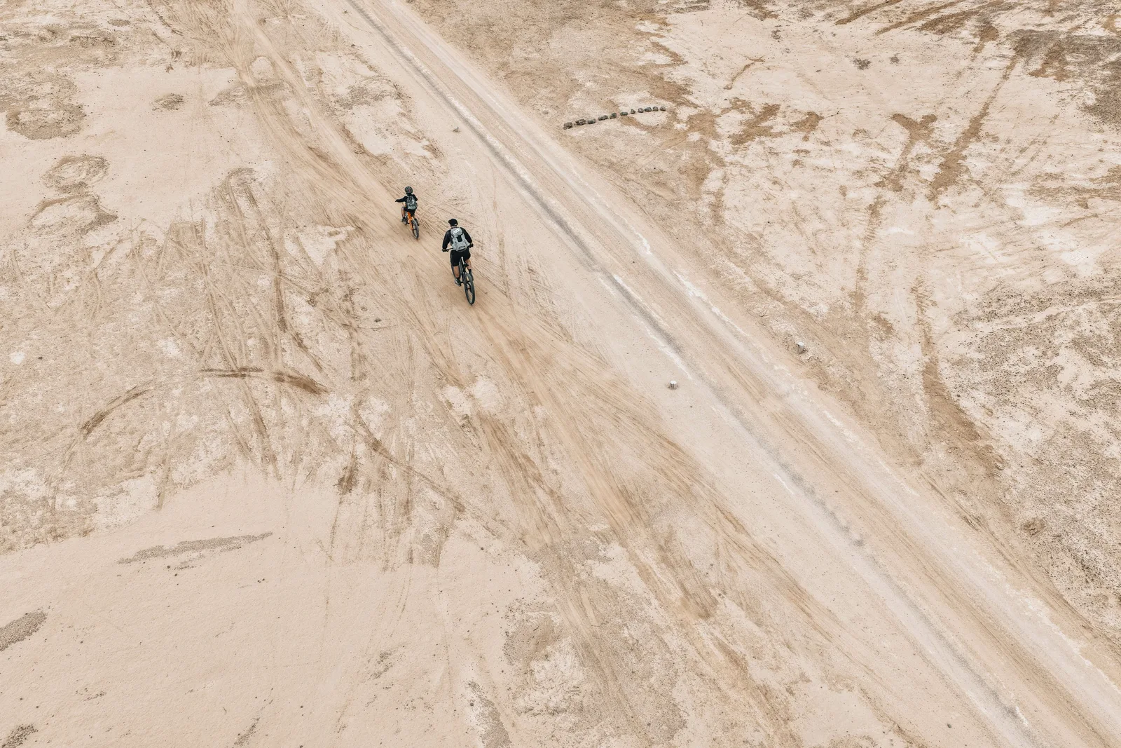 Cyclists on a sandy track on La Graciosa.